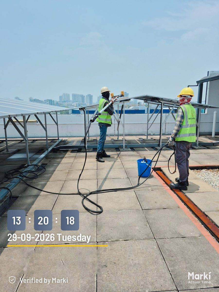 Three workers on a rooftop array