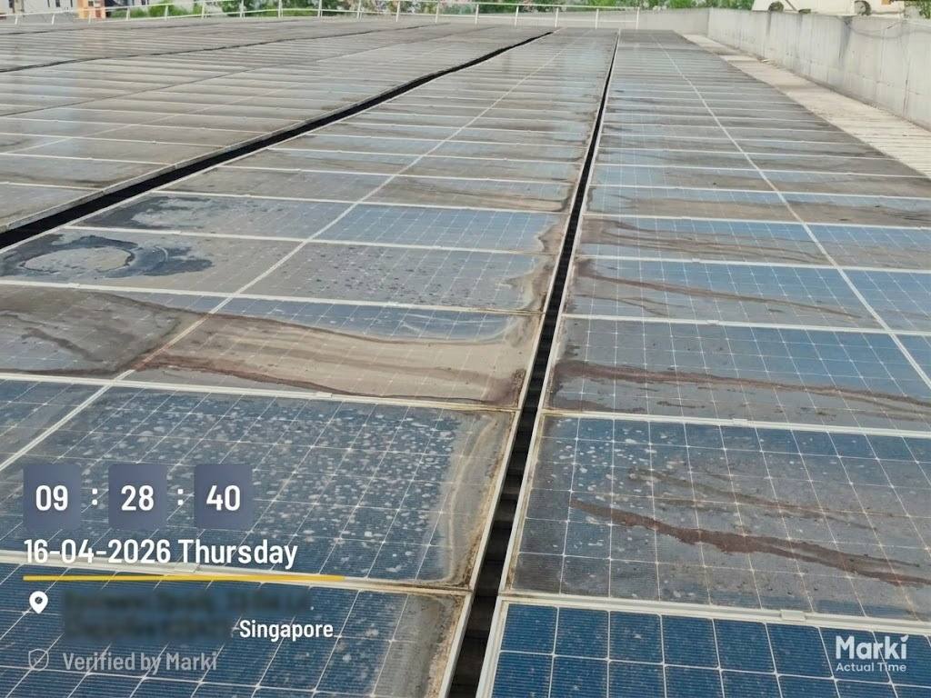 Rooftop modules before cleaning, covered in a layer of dust